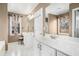 Bright bathroom with dual vanities and a soaking tub near a sunny window at 83 Southshore Ln, Dallas, GA 30157