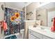 Full bathroom featuring decorative sunflower shower curtain and vanity with sink at 83 Southshore Ln, Dallas, GA 30157