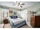 Bedroom featuring neutral carpet, ceiling fan and a large closet at 83 Southshore Ln, Dallas, GA 30157