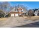 Charming brick-and-siding two-story home with a well-manicured lawn and a two-car garage at 83 Southshore Ln, Dallas, GA 30157