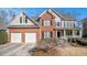 Charming brick-and-siding two-story home with a well-manicured lawn and a two-car garage at 83 Southshore Ln, Dallas, GA 30157