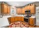 Well-equipped kitchen featuring wooden cabinets, stainless steel appliances, and white countertops at 83 Southshore Ln, Dallas, GA 30157