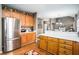 Open kitchen layout with wood cabinets, white countertops, and hardwood flooring at 83 Southshore Ln, Dallas, GA 30157