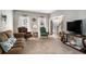 Comfortable living room with plush seating, large windows, and a view of the front foyer at 83 Southshore Ln, Dallas, GA 30157