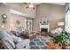 Cozy living room featuring high ceilings, a fireplace, and ample natural light at 83 Southshore Ln, Dallas, GA 30157