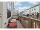 Cozy balcony with wooden railings, seating and neighborhood views at 2435 Folly Se Ln, Atlanta, GA 30339