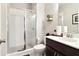 Modern bathroom with a glass-enclosed shower, vanity, toilet, and contemporary fixtures at 2435 Folly Se Ln, Atlanta, GA 30339