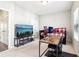 Bedroom with trundle bed features a desk and a flat screen TV at 2435 Folly Se Ln, Atlanta, GA 30339