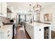 Modern kitchen featuring a white island, stainless steel appliances, and ample counter space at 2435 Folly Se Ln, Atlanta, GA 30339