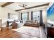 Well-lit living room with comfortable seating, hardwood floors, and a view of the staircase at 2435 Folly Se Ln, Atlanta, GA 30339