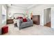 Bright main bedroom features a seating area, neutral decor, and ensuite access at 2435 Folly Se Ln, Atlanta, GA 30339