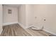 A laundry room featuring wood-look flooring, a vent, and hookups for laundry machines at 3875 Mcgill Way, Decatur, GA 30034