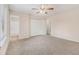 Spacious main bedroom with carpeted floors, a ceiling fan, and ample closet space at 3875 Mcgill Way, Decatur, GA 30034