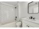 Bathroom with white subway tile shower, white marble floors, and modern fixtures at 648 Liella Se Park, Atlanta, GA 30312