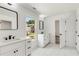 Bright bathroom featuring dual vanities and sleek black hardware, with neighborhood views at 648 Liella Se Park, Atlanta, GA 30312