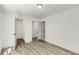 Bedroom with closet and doorway; gray vinyl flooring and white trim at 648 Liella Se Park, Atlanta, GA 30312