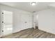 Bedroom featuring modern gray flooring with access to bathroom and closet at 648 Liella Se Park, Atlanta, GA 30312