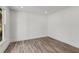 Bright, minimalist bedroom featuring luxury vinyl plank flooring and ample natural light at 648 Liella Se Park, Atlanta, GA 30312