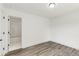 Bedroom with luxury gray vinyl flooring and en suite bathroom at 648 Liella Se Park, Atlanta, GA 30312