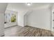 Cozy bedroom with modern grey floors and a large window showcasing neighborhood at 648 Liella Se Park, Atlanta, GA 30312