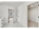 Bright hallway featuring white shaker doors, white trim, and white marble flooring at 648 Liella Se Park, Atlanta, GA 30312