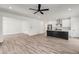 Spacious open-concept living room connected to kitchen, featuring modern finishes at 648 Liella Se Park, Atlanta, GA 30312