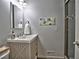 Bathroom featuring a white sink with modern fixtures and a glass shower at 7440 Princeton Trce, Sandy Springs, GA 30328