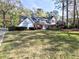 Charming two-story home with red shutters and landscaped yard at 7440 Princeton Trce, Sandy Springs, GA 30328