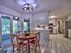 Bright kitchen with tile flooring, breakfast table, modern lighting, and stainless steel appliances at 7440 Princeton Trce, Sandy Springs, GA 30328