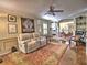 Spacious living room featuring comfortable seating, hardwood floors, and a large rug at 7440 Princeton Trce, Sandy Springs, GA 30328