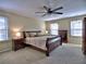 Comfortable main bedroom with neutral carpet, ceiling fan, and ample natural light at 7440 Princeton Trce, Sandy Springs, GA 30328