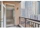 A cozy balcony overlooks the city with a view of surrounding high-rise buildings at 1101 Juniper Ne St # 722, Atlanta, GA 30309