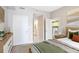 Cozy bedroom with a peek into the bathroom and kitchen at 1101 Juniper Ne St # 722, Atlanta, GA 30309