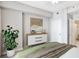 Well-lit bedroom featuring a dresser, and a partial view of the adjoining bathroom at 1101 Juniper Ne St # 722, Atlanta, GA 30309