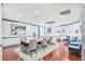 A dining room area features a wooden table with tufted chairs and modern art at 1101 Juniper Ne St # 722, Atlanta, GA 30309