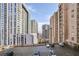 A view of a parking lot with surrounding high-rise buildings at 1101 Juniper Ne St # 722, Atlanta, GA 30309