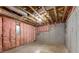 Unfinished basement with concrete foundation, insulation, and duct work at 1658 Duncan Nw Dr, Atlanta, GA 30318