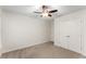 This bedroom features a ceiling fan, neutral paint, closet, and carpet at 1658 Duncan Nw Dr, Atlanta, GA 30318