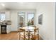 Cozy kitchen nook for dining featuring bright light, neutral paint, and backyard access at 1658 Duncan Nw Dr, Atlanta, GA 30318