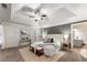 Spacious main bedroom featuring a tray ceiling with ceiling fan and ensuite bath access at 1658 Duncan Nw Dr, Atlanta, GA 30318