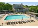 Large community pool with lounge chairs and umbrellas for residents at 1658 Duncan Nw Dr, Atlanta, GA 30318