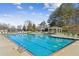 Inviting community pool with ample lounge chairs and shaded gazebo, perfect for relaxing at 340 Ruby Forest Pkwy, Suwanee, GA 30024