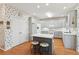 Bright kitchen with island, modern appliances and floral wallpaper at 340 Ruby Forest Pkwy, Suwanee, GA 30024