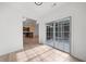 Living room with open concept view of modern kitchen, vaulted ceiling, and outside access at 404 Paperbark Ct, Acworth, GA 30102