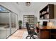 Bright home office with sliding glass doors, a modern desk, and built-in shelving at 404 Paperbark Ct, Acworth, GA 30102