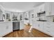 Updated kitchen with new appliances, white cabinetry, a bay window, and natural light at 455 Emerald Lake Path, Sugar Hill, GA 30518