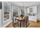 Breakfast nook with a large bay window and decorative light fixture off the kitchen at 455 Emerald Lake Path, Sugar Hill, GA 30518