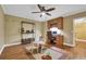 Bright playroom with desk, chair, and a large window, featuring hardwood floors and built in shelving at 455 Emerald Lake Path, Sugar Hill, GA 30518