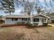 Charming single-story home featuring a welcoming front porch and well-maintained landscaping at 6518 Voyles Dr, Riverdale, GA 30274