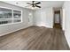 A well-lit living room showcases updated floors and large windows with neutral paint at 6518 Voyles Dr, Riverdale, GA 30274